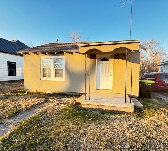 back of property with a patio area