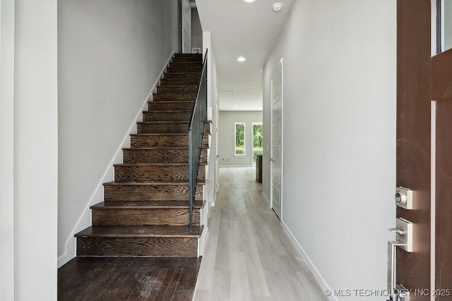 staircase featuring hardwood / wood-style floors