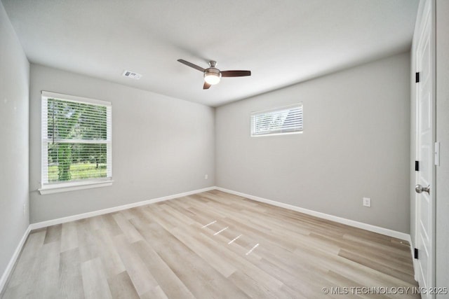 spare room featuring light hardwood / wood-style floors and ceiling fan