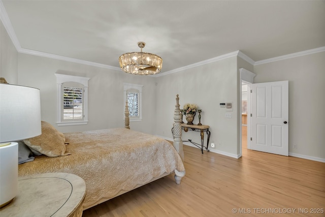 bedroom featuring ornamental molding, baseboards, a notable chandelier, and light wood finished floors