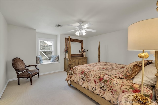 bedroom with baseboards, ceiling fan, visible vents, and light colored carpet