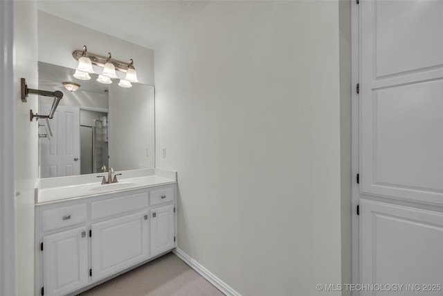 bathroom with vanity and baseboards