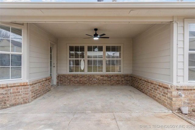 view of patio featuring ceiling fan