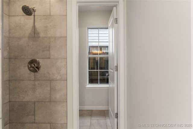 bathroom featuring tiled shower