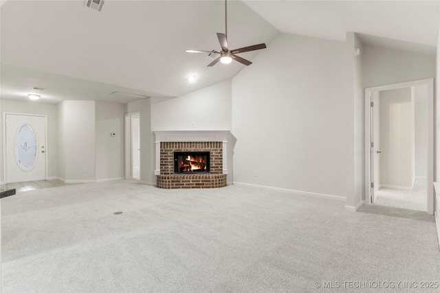 unfurnished living room with light carpet, a fireplace, high vaulted ceiling, and ceiling fan