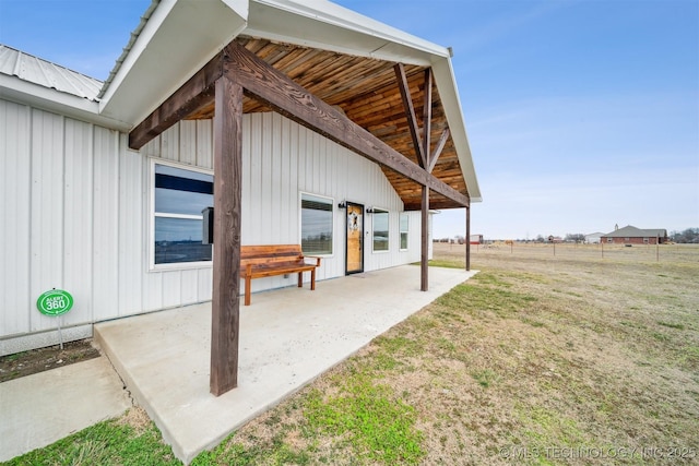 exterior space with a patio area and a lawn