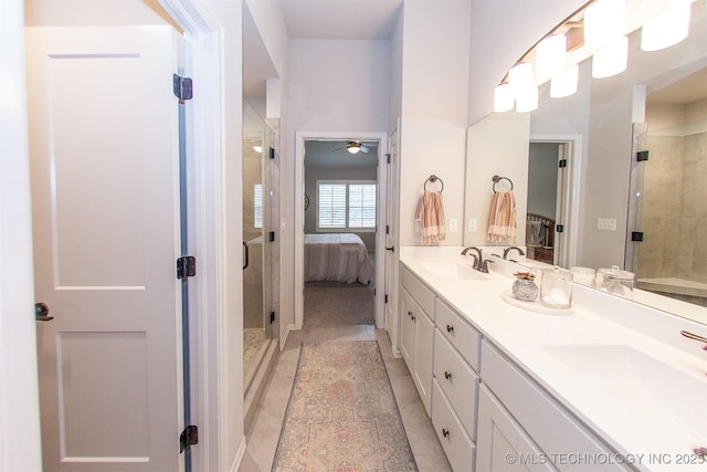 bathroom featuring vanity, an enclosed shower, tile patterned flooring, and ceiling fan