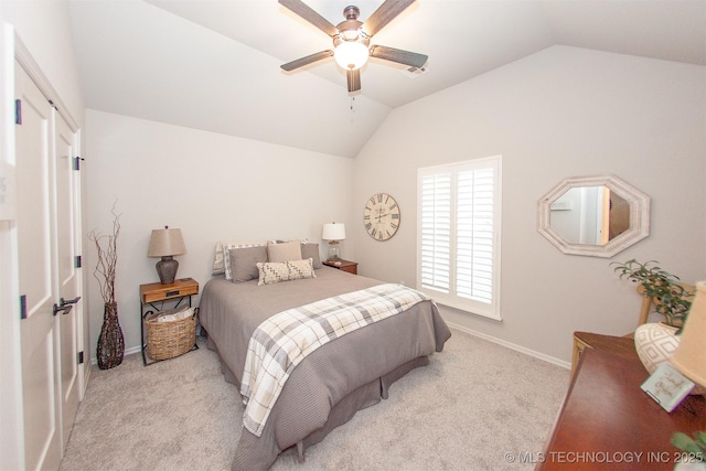 bedroom with light carpet, vaulted ceiling, and ceiling fan