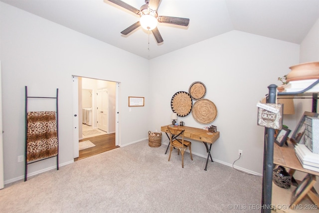 office space with vaulted ceiling, carpet floors, and ceiling fan