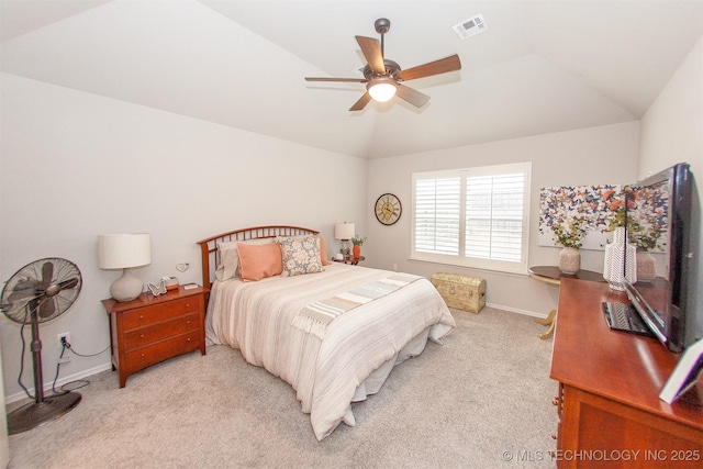 carpeted bedroom featuring lofted ceiling and ceiling fan