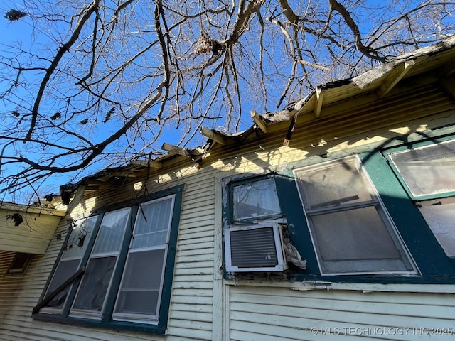 view of home's exterior with cooling unit