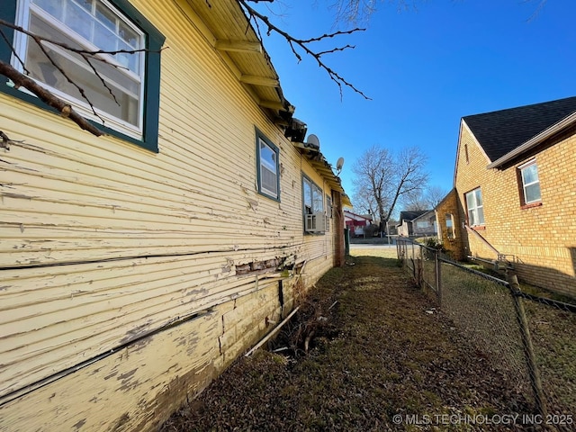 view of side of property featuring cooling unit