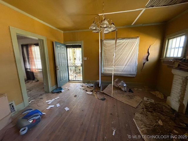 misc room with hardwood / wood-style flooring, crown molding, and plenty of natural light