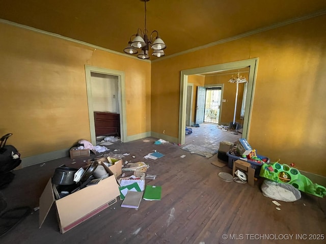 misc room featuring ornamental molding and a notable chandelier