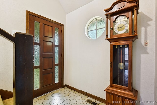 entrance foyer with vaulted ceiling