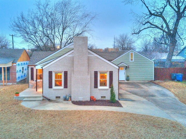 view of side of property with a lawn