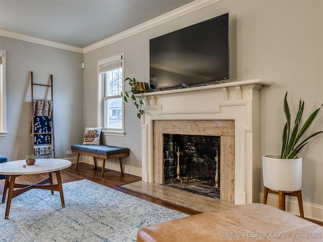 living room with ornamental molding, dark hardwood / wood-style floors, and a high end fireplace