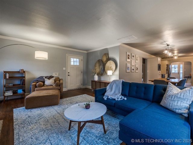 living room featuring wood-type flooring and ornamental molding