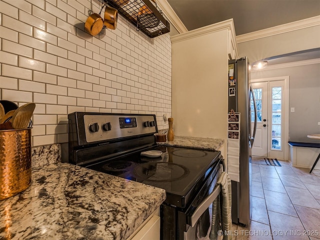 kitchen with white cabinetry, tasteful backsplash, crown molding, light stone counters, and appliances with stainless steel finishes