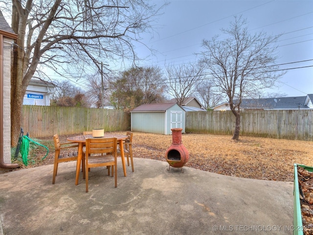 view of patio / terrace featuring a storage shed