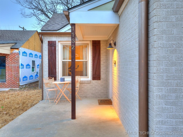 entrance to property with a patio