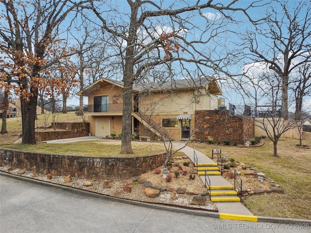 view of front of home with a garage and a front yard