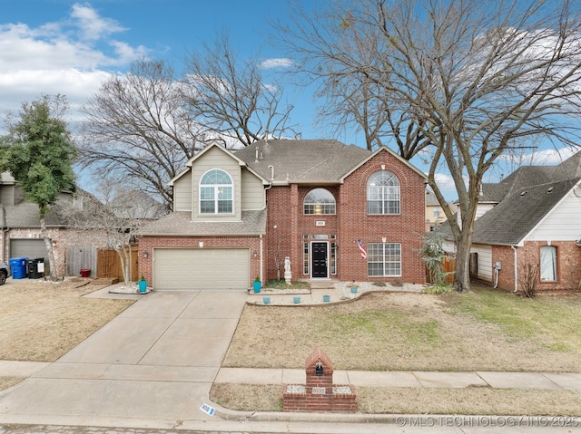 view of front of house featuring a garage and a front yard