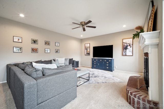 living room with ceiling fan and carpet flooring