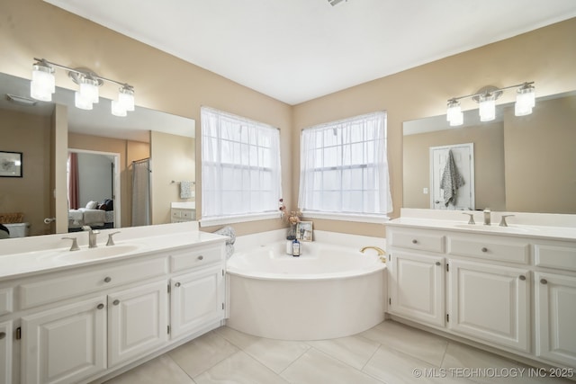 bathroom featuring vanity, tile patterned floors, and separate shower and tub