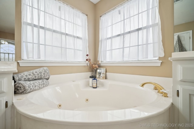 bathroom featuring a tub to relax in