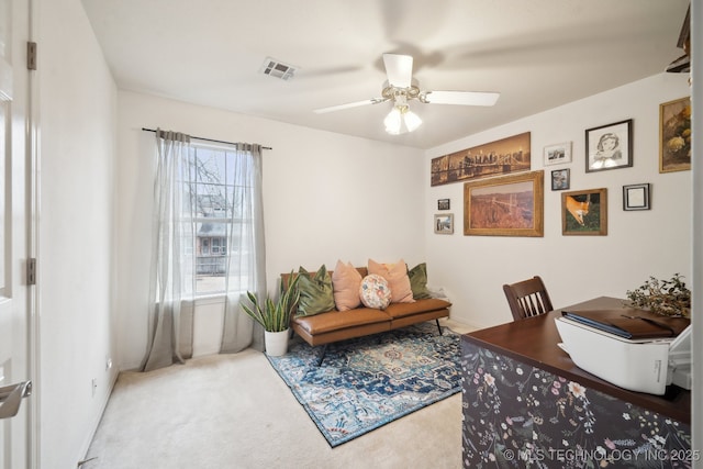 carpeted home office with ceiling fan