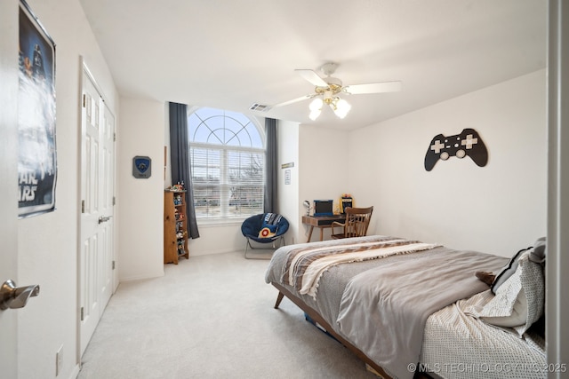 carpeted bedroom featuring ceiling fan