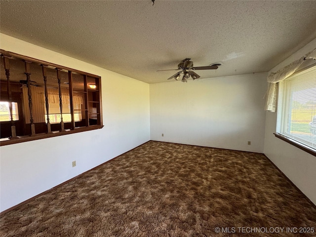 spare room with ceiling fan, carpet floors, and a textured ceiling