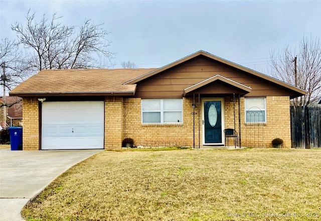 view of front of property with a garage and a front lawn