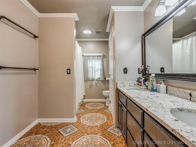 bathroom featuring tile patterned flooring, vanity, crown molding, and toilet