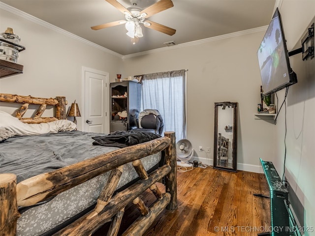 bedroom featuring dark wood-type flooring, ornamental molding, and ceiling fan