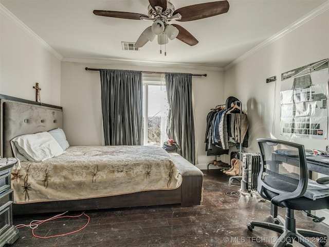 bedroom with ornamental molding, dark hardwood / wood-style floors, and ceiling fan