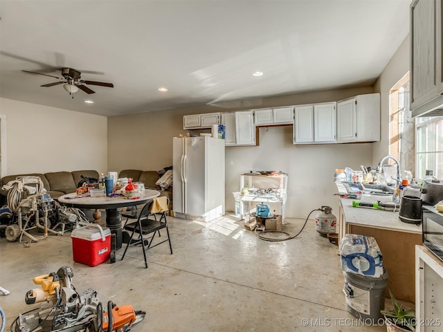 kitchen with ceiling fan and white fridge