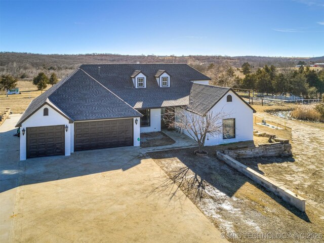 view of front of property featuring a garage