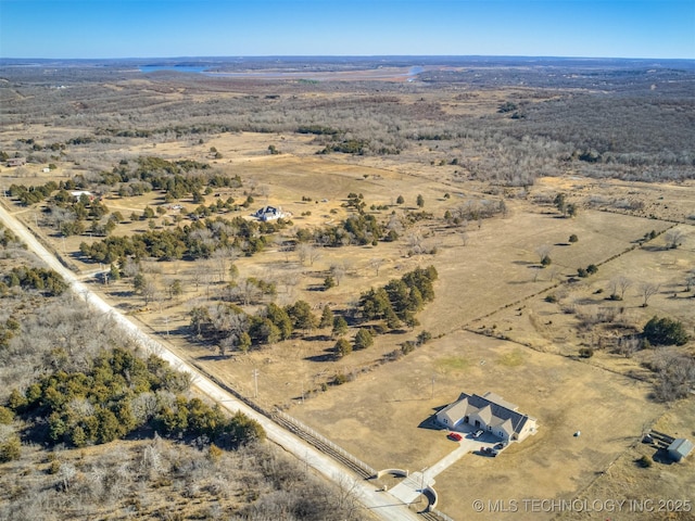 birds eye view of property with a rural view