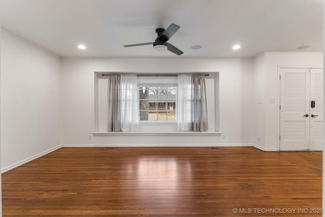 empty room featuring ceiling fan, ornamental molding, and hardwood / wood-style floors