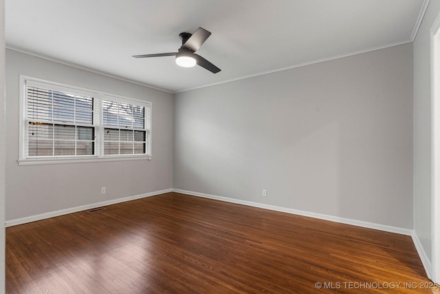 spare room featuring ornamental molding, dark hardwood / wood-style floors, and ceiling fan