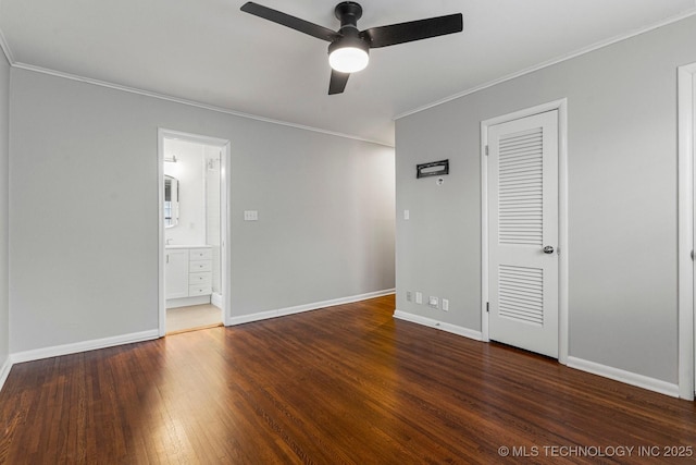 unfurnished bedroom with ornamental molding, dark hardwood / wood-style floors, ceiling fan, and ensuite bathroom