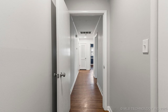 corridor featuring dark hardwood / wood-style flooring