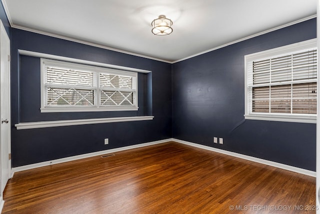 unfurnished room with crown molding and wood-type flooring