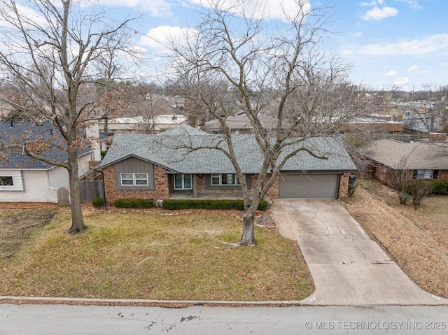 view of front of property featuring a garage and a front lawn