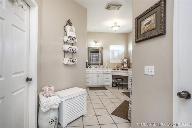 bathroom with vanity and tile patterned floors