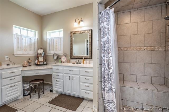 bathroom featuring vanity, tile patterned flooring, and a shower with curtain