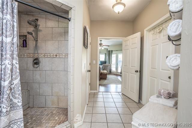 bathroom featuring a shower with curtain, ceiling fan, and tile patterned floors