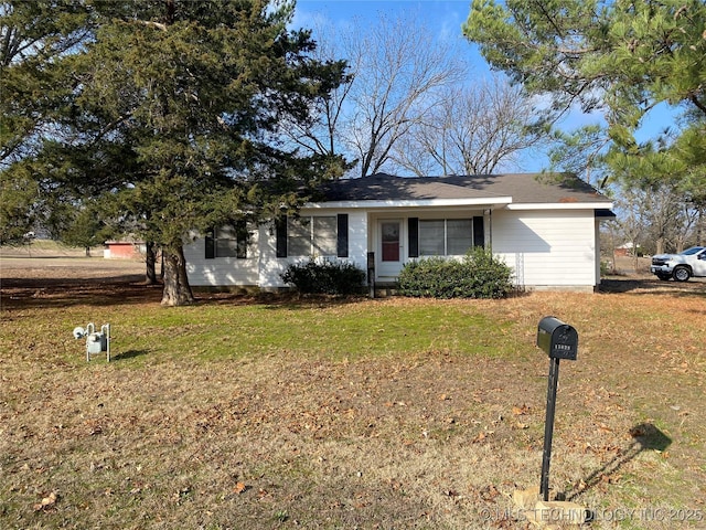 single story home featuring a front yard